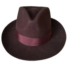 The solid pattern and brown color of this unisex fedora hat are perfect for a classic look. This hat is highly appreciated amongst men for its impressive solid pattern which will double their smartness while on a formal or classic outfit. Designed with absolute perfection, this very beautifully designed hat will boost your confidence and provides comfort in any season.

Specifications
Item Type: Fedoras
Material: Wool
Gender: Unisex
Style: Formal
Pattern Type: Solid
Department Name: Adult
 Shipp Brown Fedora, Hipster Hat, Mens Fur, Classic Outfit, Felt Fedora, Classic Brown, Solid Pattern, Classic Outfits, Fedora Hat