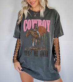 Show off your cowgirl aesthetic in our latest cowboy take me away shirt. This trendy western graphic tee is slightly disressed and oversized, perfect for a country music concert outfit. * Ultra soft * Distressed design * Pre-shrunk * Universal fit * True to size * DTG Printing * Color - Comfort Colors Refunds/Exchanges: * No Cancellations * No returns/exchanges * All sales are final Sizing: Our graphic tees and sweatshirts are a true to size standard unisex fit. For an oversized look, please siz Country Concert T Shirt Dress, T Shirt Dress Western Outfit, Country Rap Concert Outfits, Cowgirl Clothes Western, Country Concert Outfit Ideas Midsize, Oversized Western Shirt Outfit, Brantley Gilbert Concert Outfit, Cute Concert Outfit Ideas, Cody Johnson Concert Outfit