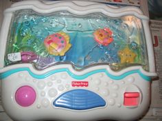 an electronic toy with fish and bubbles in it