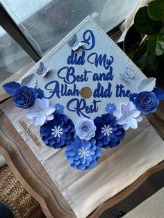 a blue and white graduation cap with flowers on it that says, dad my best and always the rest