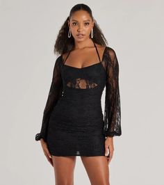 This alluring lace mini dress features a V-neckline, halter spaghetti straps with a tie-back design, sheer long balloon sleeves, and a sheer insert under the bust for a chic look. The short ruched bodycon silhouette will showcase your stunning curves.Fit & FeaturesSheer lace fabric with partial liningV-neckline, halter spaghetti straps with tie-back designSheer long balloon sleevesSheer insert under the bustRuched side and back seams, back zipper closureMini-length bodycon silhouetteRuns tru Lace Long Sleeve Mini Dress, Orange Homecoming Dresses, Long Sleeve Lace Mini Dress, Backless Dress Short, Purple Homecoming Dress, Green Homecoming Dresses, White Homecoming Dresses, Lace Dress Styles, Homecoming Outfits