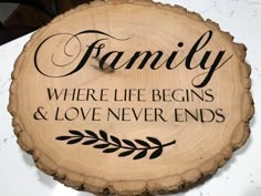 a wooden sign that says, family where life begins and love never ends on it