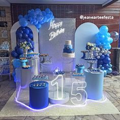 a birthday party with blue and white decorations