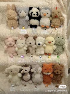 a group of stuffed animals sitting on top of a white bed covered in a blanket