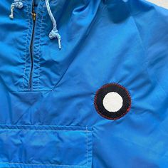 This is an upcycled vintage windbreaker, most likely made of nylon. We placed a full-moon patch over the front left chest and and original embroidered patch on the back. This sweatshirt is unique and may have slight imperfections, stains, snags, or blemishes. color: Flat Cobalt Blue size: M (26"H x 23"W) Please note: This is a vintage item and not returnable. Vintage Patchwork Windbreaker For Outdoor, Casual Hooded Outerwear With Embroidered Patch, Casual Windbreaker With Embroidered Logo For Winter, Outdoor Cotton Outerwear With Logo Patch, Cotton Outerwear With Logo Patch For Outdoor, Retro Cotton Hooded Windbreaker, Retro Hooded Cotton Windbreaker, Retro Cotton Windbreaker For Outdoor, Casual Outerwear With Patches For Outdoor