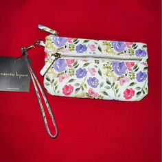 Get Out Carrying Your Basic Essentials With The Nanette Lepore Tech Wristlet. This Faux-Leather Wristlet Is Crafted With A Detachable Wrist Strap, Exterior Zippered Pocket With Logo Stamp, Top Main Zippered Compartment And A Smaller Interior Zippered Pocket With Logo Patch Making This The Perfect Grab-And-Go Choice. Classic Wristlet Stylish And Versatile Made From Smooth And Luxurious Leather, Nanette Lepore Is Your Perfect Day To Evening Clutch. It Has All The Functionality Of Your Favorite Wal Spring Gift Wristlet With Wrist Strap, Spring Pouch Wristlet With Zipper Closure, Spring Zipper Pouch Wristlet Clutch, Spring Wristlet With Zipper Closure In Pouch Shape, Spring Wristlet With Wrist Strap For Everyday Use, Elegant Spring Wristlet For Everyday, Rectangular Wristlet For Spring Gift, Rectangular Wristlet As Spring Gift, Rectangular Wristlet Gift For Spring