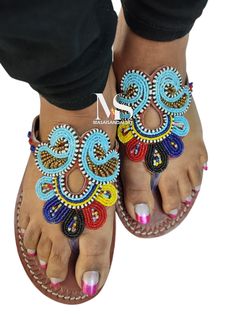 100% handmade using leather and fine beads. Masai beaded sandals are made using the pure original leather and quality African beads.They are inspired by the Masai community They are perfect for any occasion. True to size. We ship worldwide. Feel free to send me a convo for any clarifications Traditional Beaded Barefoot Sandals With Single Toe Strap, Traditional Handmade Closed Toe T-strap Sandals, Traditional Blue Sandals For Festival, Traditional Handmade T-strap Open Toe Sandals, Traditional Blue Sandals For Beach, Blue Beaded Sandals For Vacation, Traditional Handmade T-strap Sandals, Blue Beaded Open Toe Sandals, Blue Beaded Sandals For Beach