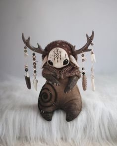 a stuffed animal with antlers on it's head