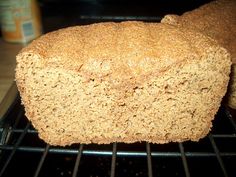 a loaf of bread sitting on top of a metal rack