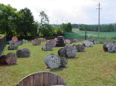 an outdoor area with large rocks in the grass