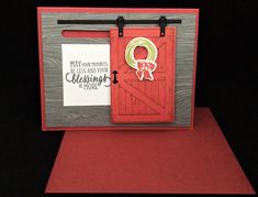 a handmade card with a red door