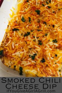 a cheesy casserole dish with cheese and spinach on the side