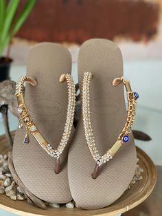 Glamour at your feet! All sandals are handcrafted with the finest Brazilian embellishments. We use the original Havaianas®️: thong style made in Brazil 100% rubber non slip tread durable and flexible Customized items are final sale so they can’t be returned. Havaianas Flip Flops, Made In Brazil, Womens Flip Flop, All Design, Evil Eye, 9 And 10, Brazil, Flip Flops, Embellishments