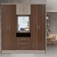 a large wooden cabinet with drawers and mirror in the middle, next to a dining room table