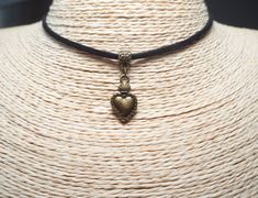 Sacred Heart Necklace  Heart Pendant  Cord Choker  Bohemian Necklace  Mexican Choker  Unisex Jewelry  Christmas Gift ~ A boho necklace with metal pendant. ~ Black colour cord, 12" shortest length.  ~ Clasp and 2" extender chain to adjust to you.  ~ Made with the utmost care to enjoy it as long as possible. All jewelries are are in stock and ready to be shipped within 1-2 business day from ordering to dispatch. Please note these times increase during Christmas & busy periods. 🌍 SHIPPING & DELIVE Heart Beads Festival Choker, Vintage Heart Charm Choker Jewelry, Festival Heart Beads Choker Jewelry, Vintage Heart Charm Choker, Heart Beads Choker For Festival, Heart-shaped Metal Necklaces For Festivals, Heart-shaped Metal Necklace For Festival, Nickel Free Heart Shaped Jewelry For Festivals, Nickel-free Heart-shaped Jewelry For Festival