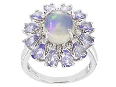 10x8mm Ethiopian Opal With 2.00ctw Tanzanite And 0.05ctw White Zircon Rhodium Over Sterling Silver Ring. Not sizable. Silver Multi-stone Cluster Ring With Oval Shape, Oval Silver Cluster Ring With Multi-stone, Silver Multi-stone Pear-shaped Jewelry, Silver Oval Cabochon Jewelry With Center Stone, Silver Pear-shaped Multi-stone Jewelry, Pear-shaped Multi-stone Silver Jewelry, Sterling Silver Oval Cabochon Multi-stone Jewelry, Sterling Silver Multi-stone Jewelry With Oval Cabochon, Silver Pear-shaped Gemstone Jewelry