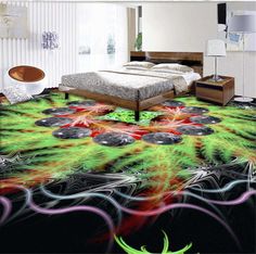 a bed room with a neatly made bed next to a painting on the floor that looks like an abstract flower