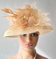 The featured listing is a dressy wide brimmed pale gold straw hat. A crinoline design in amber color sits at the side of the hat. Some sinamay, some feathers, amber netting also adorns the hat. All the elements combining  making the hat so interesting and softly dramatic. This  hat is  beautiful for the Kentucky Derby or  for  Sunday  Church.  It is also perfect for an Easter Hat, Tea Party hat,Wedding Party Hat, Fancy Dress Hat, Retro Hat, Downton Abbey hat, Audrey Hepburn style hat and any oth Luxury Pinched Crown Hat For Kentucky Derby, Luxury Cream Top Hat For Kentucky Derby, Luxury Cream Hat For Kentucky Derby, Wedding Dress With Wide Brim Hat, Audrey Hepburn Hats, Crinoline Hats, Audrey Hepburn Hat, Gold Straws, Hat Tea Party