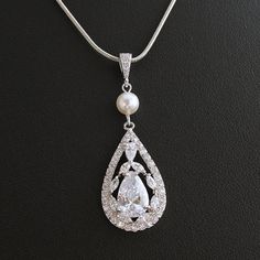 Wedding Necklace Bridal Jewelry with Luxury Large by poetryjewelry, $38.00 White Pearl Drop Bridal Necklace With Cubic Zirconia, Diamond White Drop Necklace For Wedding, White Cubic Zirconia Bridal Necklace With Pearl Drop, Pear-shaped Diamond White Wedding Jewelry, Silver Teardrop Pendant Necklace For Wedding, Elegant Teardrop Drop Necklace With Pearl Charm, Silver Cubic Zirconia Pearl Necklace For Wedding, Classic Teardrop Necklace For Wedding, Silver Pear-shaped Bridal Necklace For Formal Occasions