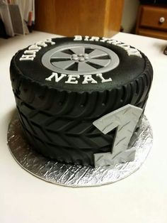 a black cake with white writing on it