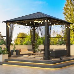 a gazebo sitting on top of a patio covered in lights