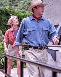 an older man and young woman walking down stairs