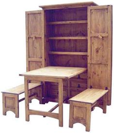 a wooden table with two benches next to it and a cabinet in the back ground