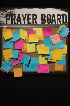 a bulletin board with post it notes attached to it and the words prayer board written on it