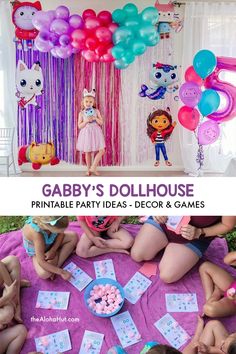 a birthday party with balloons, streamers and games for children to play on the floor