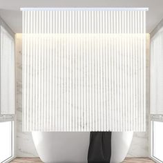 a white bath tub sitting under a window next to two windows with blinds on them