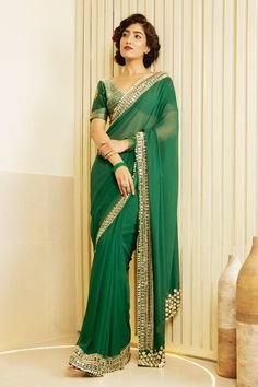 Emerald green saree with hand embroidered border in metallic gold and pearls. Comes with hand embroidered unstitched blouse piece.
Component: 2
Pattern: Embroidered
Fabric: Chanderi
Color: Green
Other Details: 
Note: Blouse worn by the model is not for sale
Occasion: Wedding - Aza Fashions Designer Party Wear Saree, Saree Women, Wedding Sarees Online, Designer Sarees Wedding, Latest Designer Sarees, Border Saree, Party Wear Saree, Green Saree, Indian Clothes