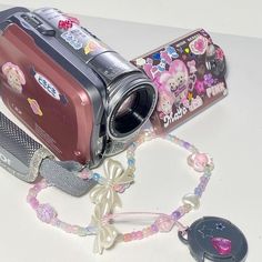 a camera and some beads on a table