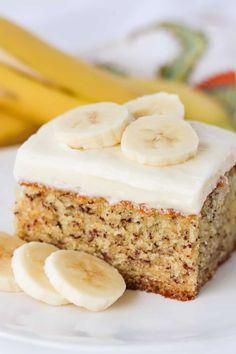 a piece of banana cake on a plate with bananas