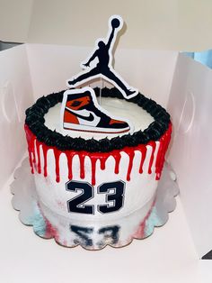 the cake is decorated with an air jordan shoe