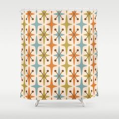 a shower curtain with an abstract design in orange, blue and green colors on it