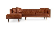 a brown leather couch with pillows on the back and arm rests against a white background