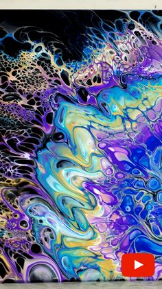 an abstract painting with blue, purple and yellow colors on it's surface is featured in this video