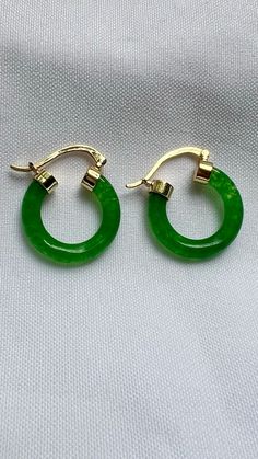 Add a touch of timeless elegance to your collection with our stunning Jade Hoop Earrings. Handcrafted with care, these earrings are perfect for any occasion. Don’t miss out on our limited-time offer – enjoy 25% off on your purchase at our Etsy shop. Elevate your style today with these beautiful jade hoops! #etsyseller  #etsyfinds  #etsyjewelryshop  #jewelryaddict  #jewelrytrends  #giftsforher  #shopsmall  #925sterlingsilver  #giftsforher  #earringsoftheday #bohochic  #ringsjewelry  #stackablerings  #stacking  #daintyjewelry #jade #sale  #jewelryaesthetic #earringsoftheday  #earrings #earringstyle Green Tarnish-resistant Huggie Jewelry, Elegant Green Dangle Huggie Earrings, Elegant Green Hoop Earrings Pierced, Elegant Green Huggie Jewelry, Elegant Green Pierced Hoop Earrings, May Birthstone Round Hoop Earrings For Pierced Ears, May Birthstone Round Hoop Earrings, Green Tarnish Resistant Hoop Earrings For Gift, Green Small Hoop Earrings Tarnish Resistant