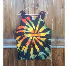 Unisex tank top hand dyed in Oregon USA. I carefully wash everything and use a special dye removing detergent so it's ready to wear right away and safe to wash with your other laundry. The fabric dyes bond to the fabric permanently and will stay bright and beautiful for the life of the garment. Safe to machine wash and dry. Do not bleach. Tie-dye Cotton Tank Top, Tie Dye Cotton Tank Top, Festival Acid Wash Cotton Tank Top, Acid Wash Cotton Tank Top For Festivals, Acid Wash Cotton Tank Top, Hand Dyed Acid Wash Sleeveless Top, Acid Wash Hand-dyed Sleeveless Top, Acid Wash Hand Dyed Sleeveless Top, Tie Dye Cotton Sleeveless Tank Top