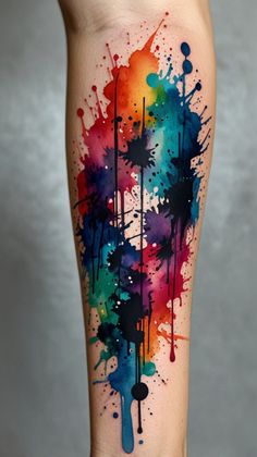 colorful ink splattered tattoo on the leg