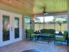 a living room filled with furniture and a fire place next to a sliding glass door