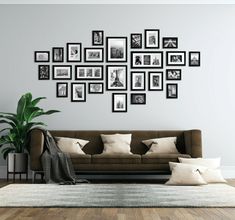 a living room filled with furniture and lots of framed pictures on the wall above it