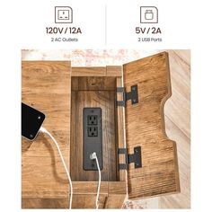 an open wooden box with two outlets and one plugged into the power outlet in it