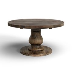 a round wooden table with two pedestals