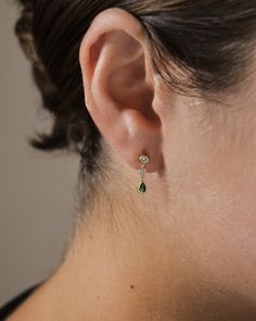 Make a statement with these Mae Drop Studs: dainty earrings with a drop design and an emerald accent for that extra sparkle. All eyes will be on you in these timeless earrings! Make a lasting impression with these on-trend drop studs. Materials: 14K gold plated sterling silver or sterling silver, cubic zirconia Features: 0.6" drop, 0.1" width, 2-3.75mm stones, Lead & Nickel free, post back Emerald Bridal Earrings, Timeless Earrings, Small Drop Earrings, Drop Design, Free Post, Pearl Earrings Dangle, Drops Design, Dainty Earrings, Sterling Silver Hoops