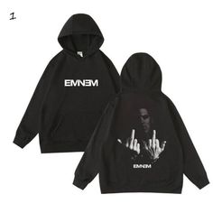 the emim hoodie is shown in black with white lettering and hands on it