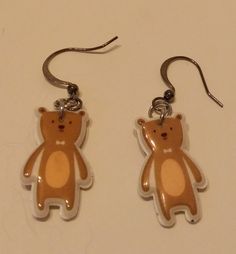 Dangle earrings of a brown bear wearing a bow tie. Cute Brown Dangle Earrings, Cute Brown Earrings Gift, Cute Brown Earrings As Gift, Cute Brown Earrings For Gift, Teddy Bear Earrings, Bear Earrings, Cute Teddy Bear, Cute Teddy, Cute Teddy Bears