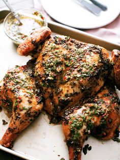 grilled chicken with herbs and seasoning on a tray