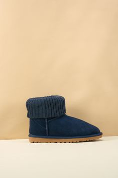 Step into cozy style with the SMAIBULUN Ugg Ankle Knit Stocking Short Boots. The ankle knit design can be folded for extra warmth, perfect for chilly days. The deep navy color adds a touch of sophistication to these versatile boots. Elevate your winter wardrobe with these must-have boots! 1'' heel 6.2'' shaft 15.2'' circumference Pull-on Lightly padded footbed Leather suede upper Faux fur lining Lightweight cushioning EVA sole Feature: Ankle knit stocking can be folded supply extra warm. Cozy Warm Boots For Cold Weather, Warm Cozy Boots For Cold Weather, Casual Warm Booties For Winter, Casual Warm Winter Booties, Casual Winter Booties With Padded Ankle, Warm Cozy Winter Booties, Casual Warm Booties With Round Toe, Comfortable Warm Booties For Winter, Casual Blue Winter Booties