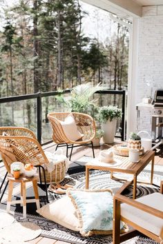 an outdoor living room with wicker furniture